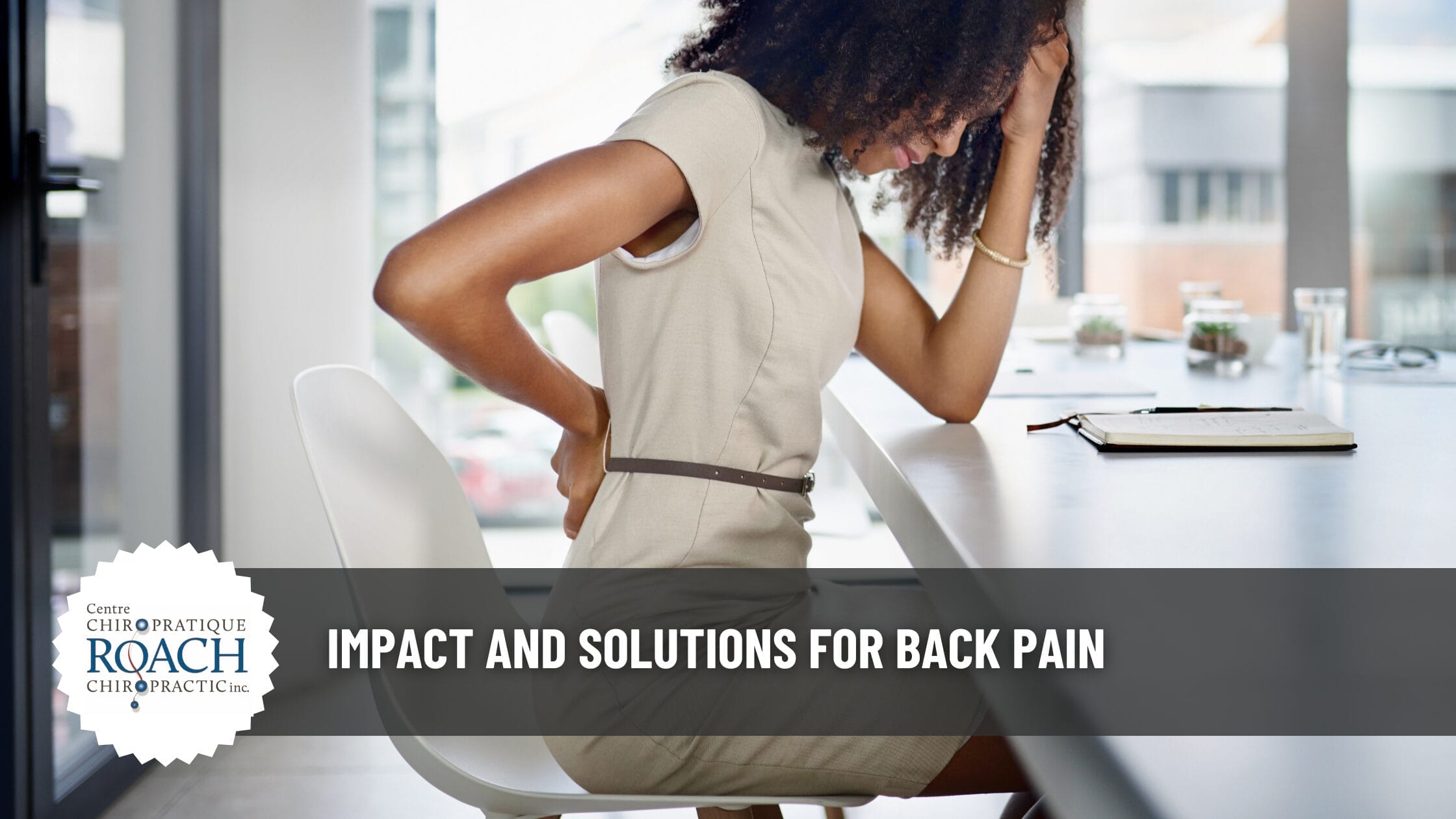 woman placing her right arm on her back experiencing back pain