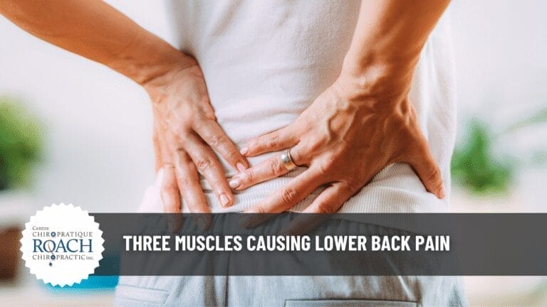 Three Muscles Causing Lower Back Pain 1 person holding their back with both hands experiencing lower back pain