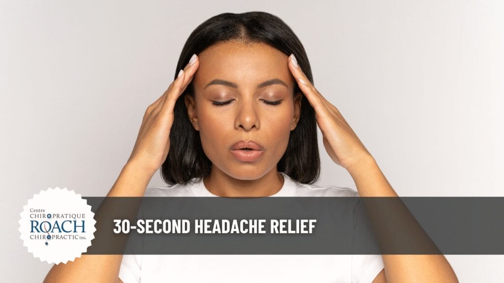 a woman with her hands placed on the sides of her head, using a headache relief technique