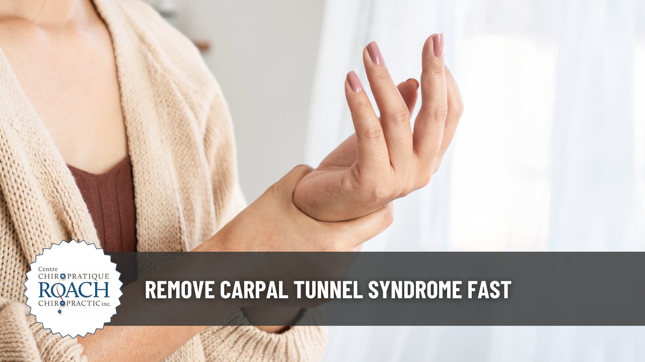 person holding their wrist with carpal tunnel syndrome