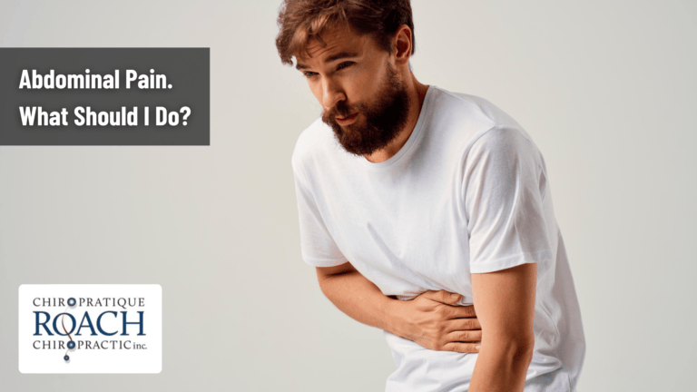 a man with a beard holding his stomach with abdominal pain
