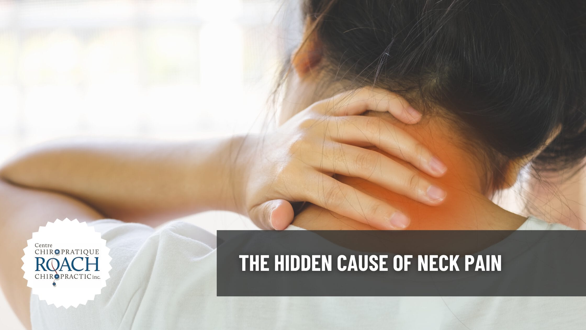 The Hidden Cause of Neck Pain 1 a woman grasping the back of her neck in pain