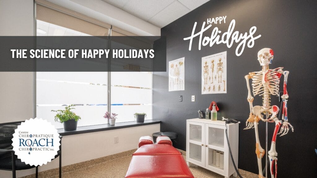 The Science of Happy Holidays 2 a chiropractic room with happy holidays written on the wall