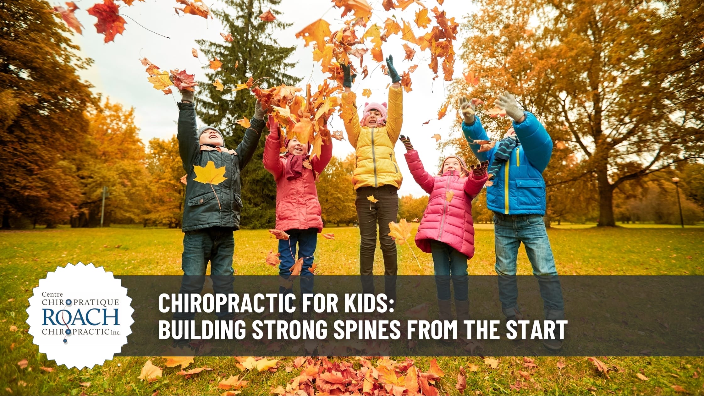 a group of kids in various bright outdoor fall clothing raising their hands up in the air, enjoying healthy lives