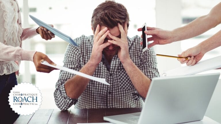 a person surrounded by colleagues at work asking questions and creating a stressful working environment