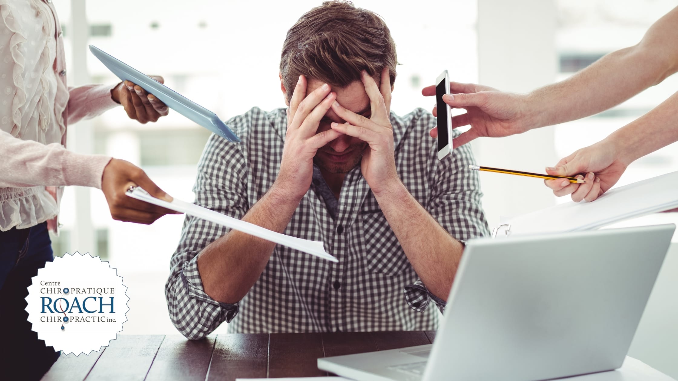 a person surrounded by colleagues at work asking questions and creating a stressful working environment